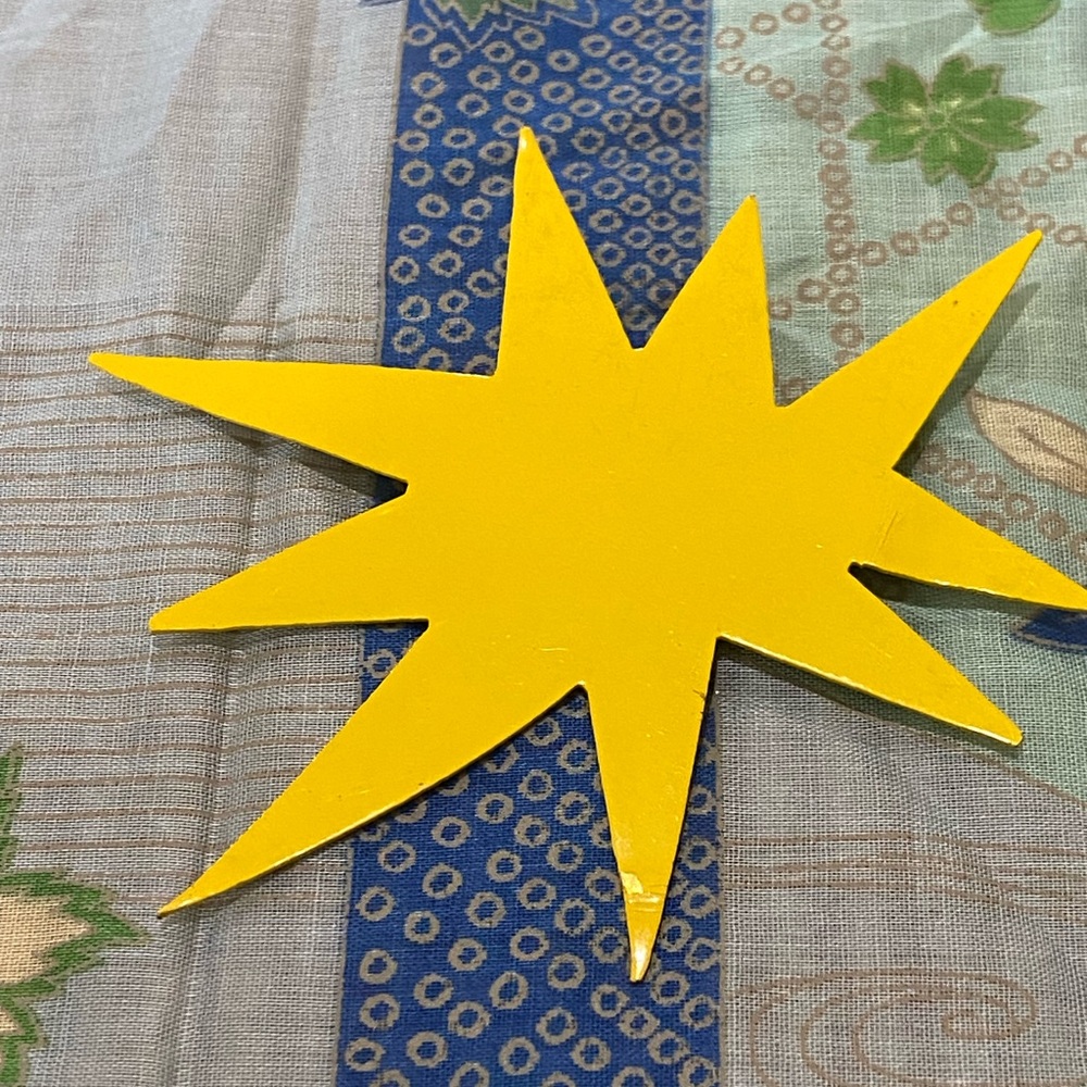 Yellow Starburst pin by jeweler Patrick Rétif (1958-1952), Paris.